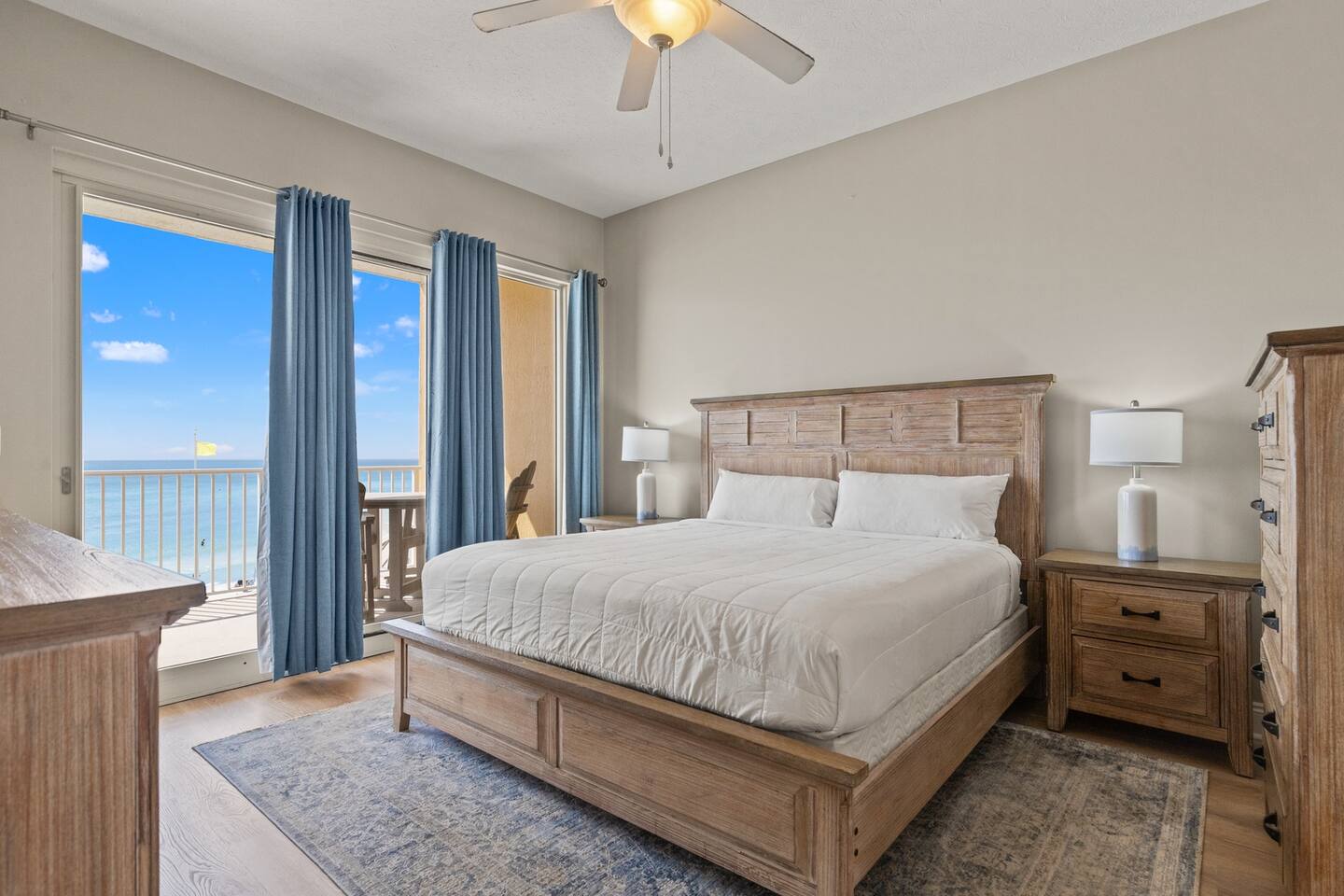 Main king bedroom opening onto the Gulf-facing balcony